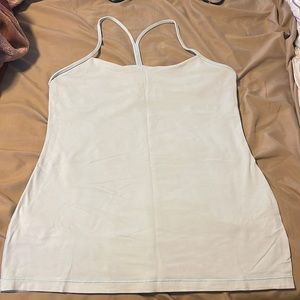 Tank top that is light blue and a bra inside
